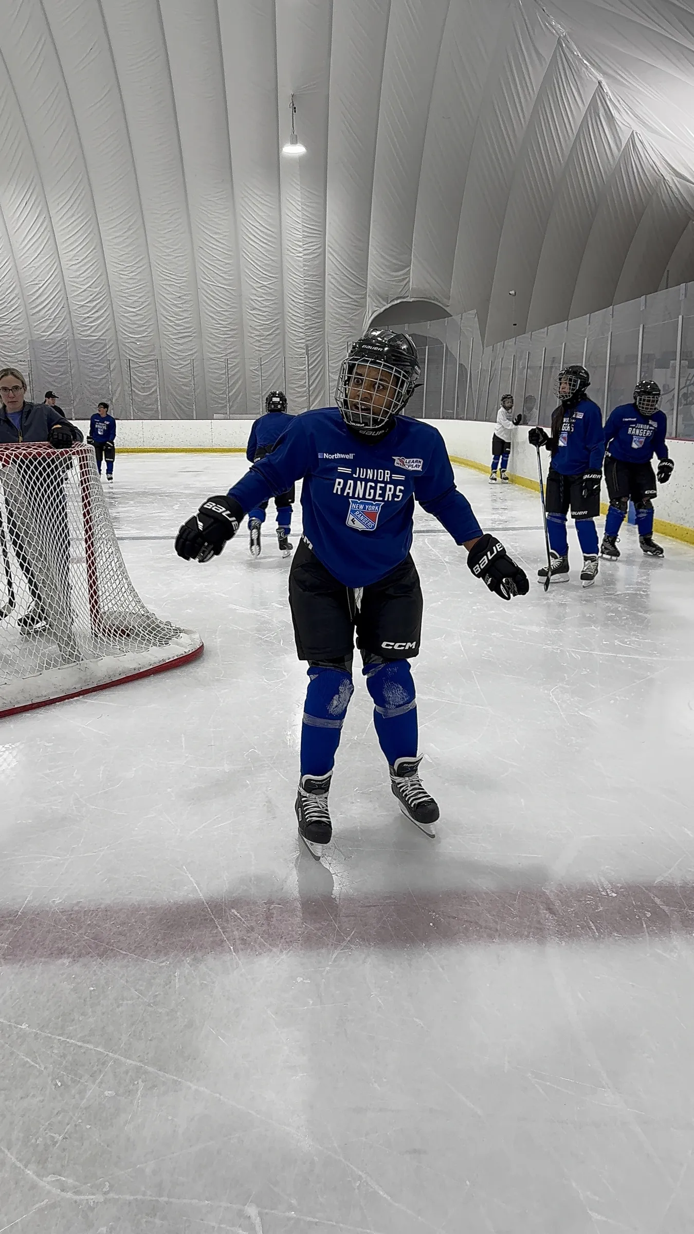Young hockey player learning